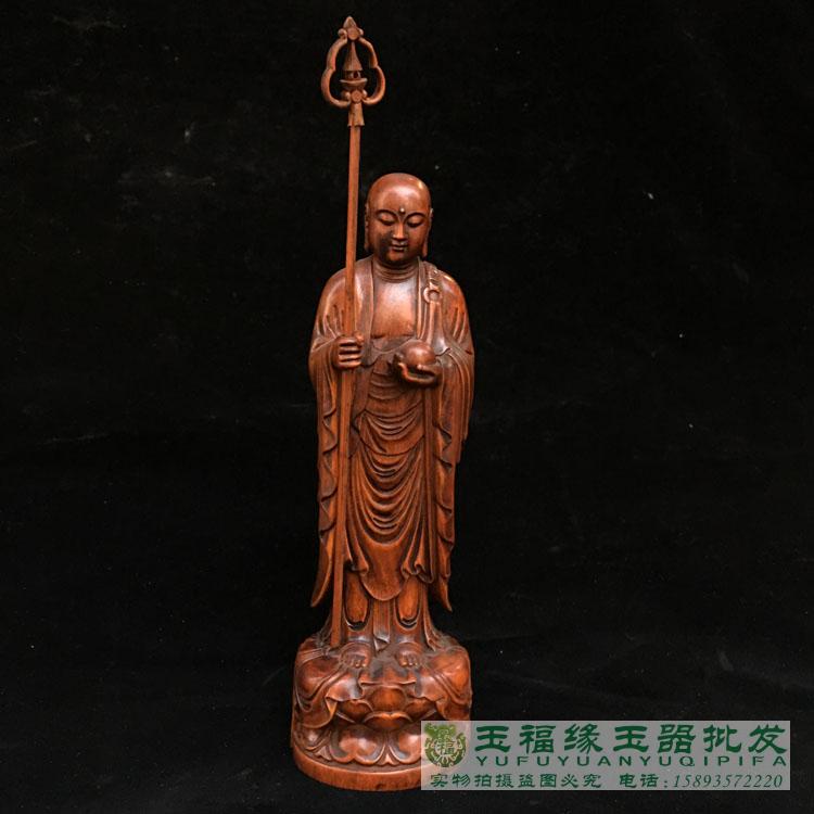 Ancient play of antique wood carvers yellow poplar wood carvings of the Bodhisattva site Tibetan Buddhist statues stand like a monk at the mercy of the Tang monk