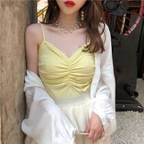 Suspended womens suit with pleats and a sexy sleeveless kni