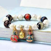 Swallowing incense gray glass five-color transfer beads white Tang carved porcelain shaking round beads ancient method hand-made gold beast family of three bracelets with the same sound