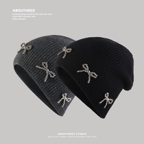 Korean niche hat womens bow knitted woolen hat autumn and winter high-end cold hat warm and versatile ear protection hat trend