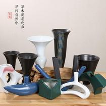 A frosted black tall flower arrangement vessel Ohara Ryuchibo Japanese Zen flower arrangement tea room hotel decoration