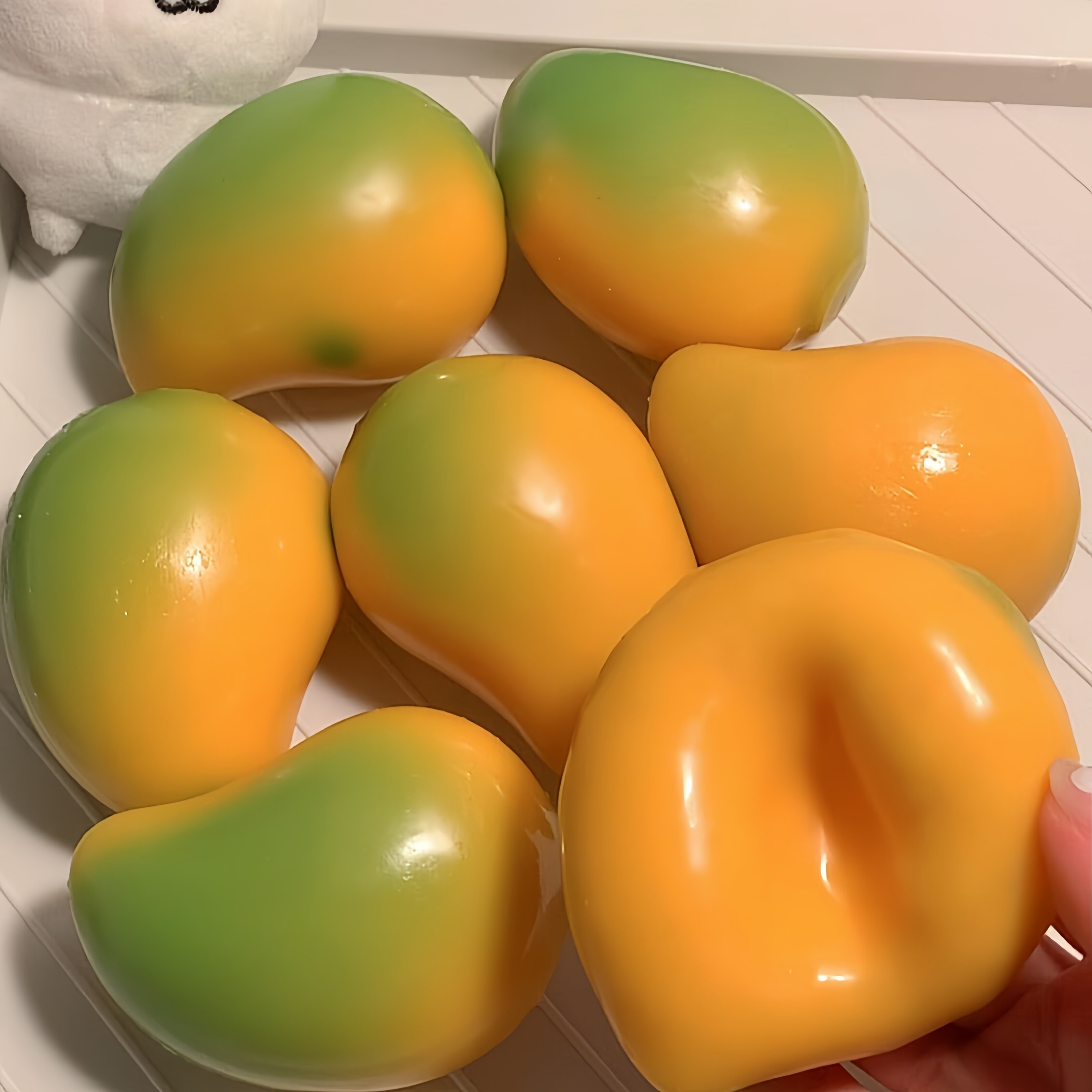 新款芒果变色捏捏乐新奇特创意玩具可塑形流体芒果温变解压玩具