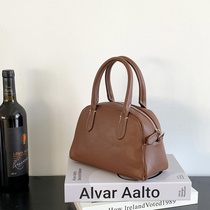 Korean version hand-held bowling bag versatile simple and stereotyped shoulder commuter bag fashionable and western-style cross-body Boston bag