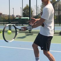 Rotating tennis training device coach-guided movements topspin cutting volleying and serving fixed action training device