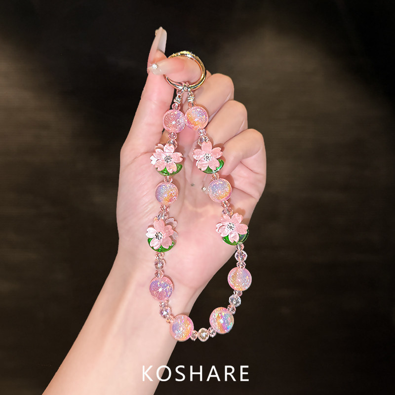 Peach blossom shimmering crossbody bag/carry heavy-duty phone holder/wrist chain, understated luxury, niche, exquisite, high-end, fashionable, unique, drop-proof lanyard, neck strap, hand-carry crystal pendant, trendy new women's style beads.