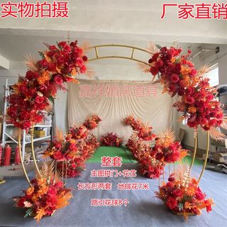 Chinese wedding floral arrangement, red road leading flower row scene layout, finished flower road leading flower arrangement, wedding venue flower row arch