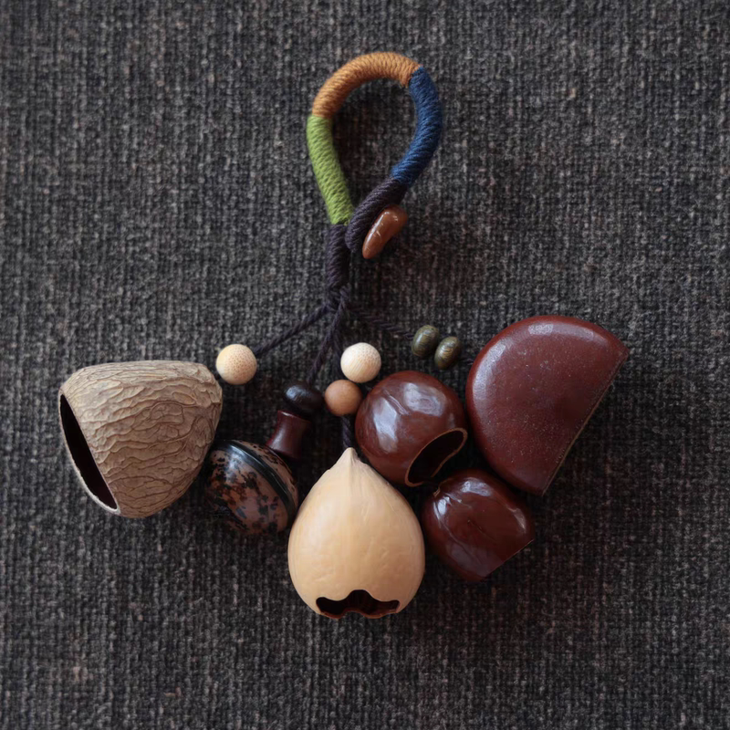 Indonesian Black Fruit Shell Rattles with Cardamom and Phoenix Egg Flower Trim, Fruit Shell Flower Roots, and Kookoo Shells Can Be Used as Keychains or Bag Pendants