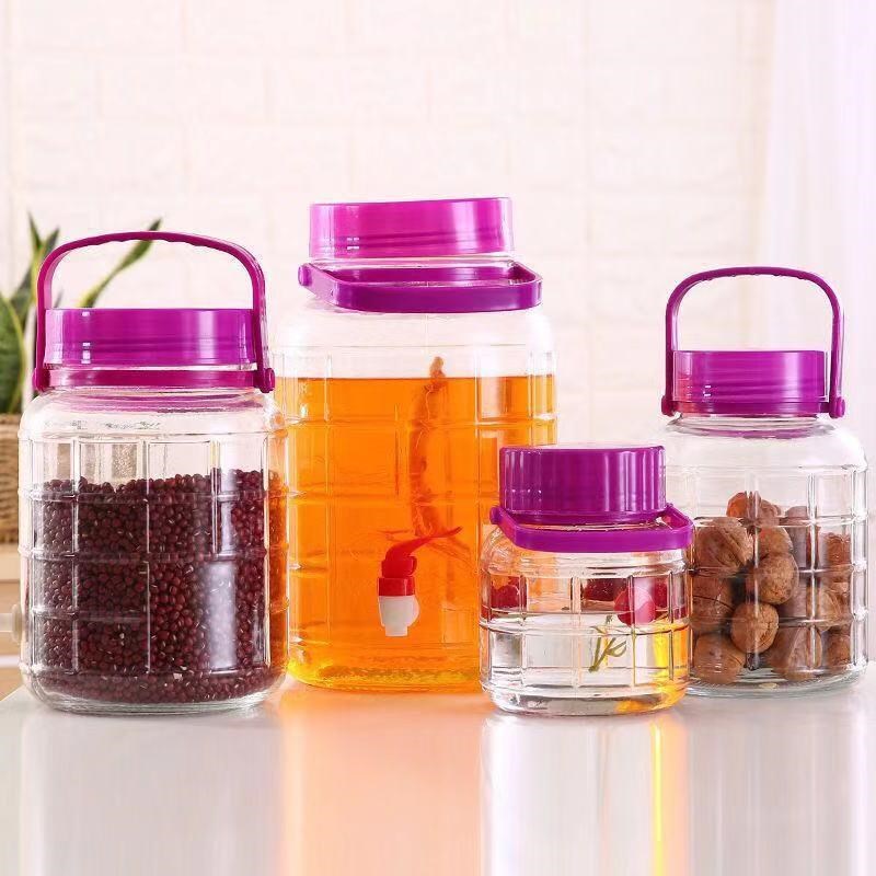 Manufacturer of wine glass bottles, sealed glass jars, kitchen glass wine jars, square wine bottles, pickle jars