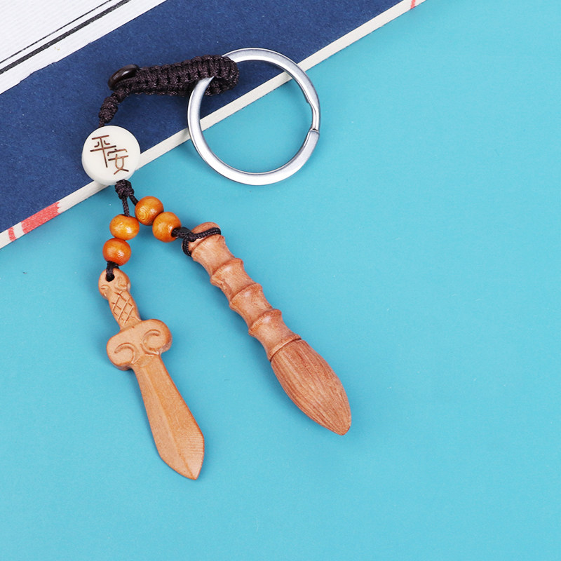 Southeast old peach wood folk custom carry-on mascot good luck small hanging decoration Anzhai baby body protection peach wood sword key hanging decoration