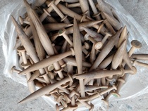 A batch of old textile machine shuttles smooth wooden sticks hammers laces wooden shuttles.