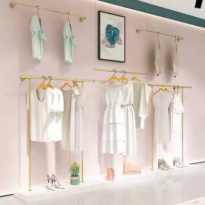Golden Marriott clothing store display stand on the wall hanging ceiling hanging gold hanger hanging clothes pole Wall wall hanging clothes shelf