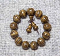 Gloomy golden nanmu hand string small leaf Zhennan Ebony head yellow material 1 8 Buddha beads full of water wave cloud collection