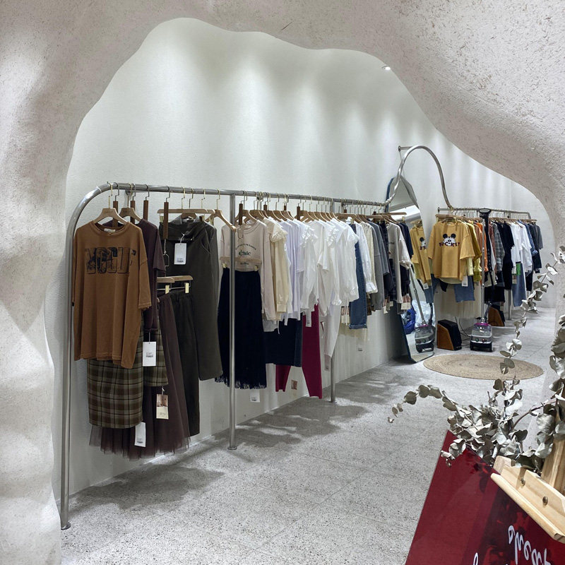 Clothing store display stainless steel drawing on walls hanging clothes shelver display hanging garment rack women's clothing rack