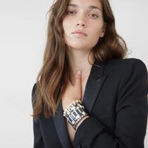 American roxanne assouli with black gold bracelet