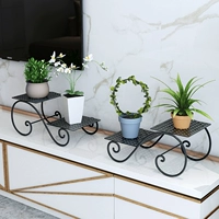 Железная многопрофильная цветочная полка пол на пол домовладельца гостиная.