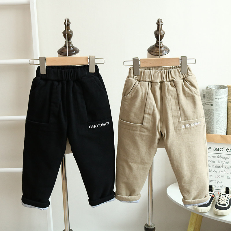 A winter boy clamps cotton pants in winter baby thickens cotton pants outside wearing three layers of warm and cotton pants