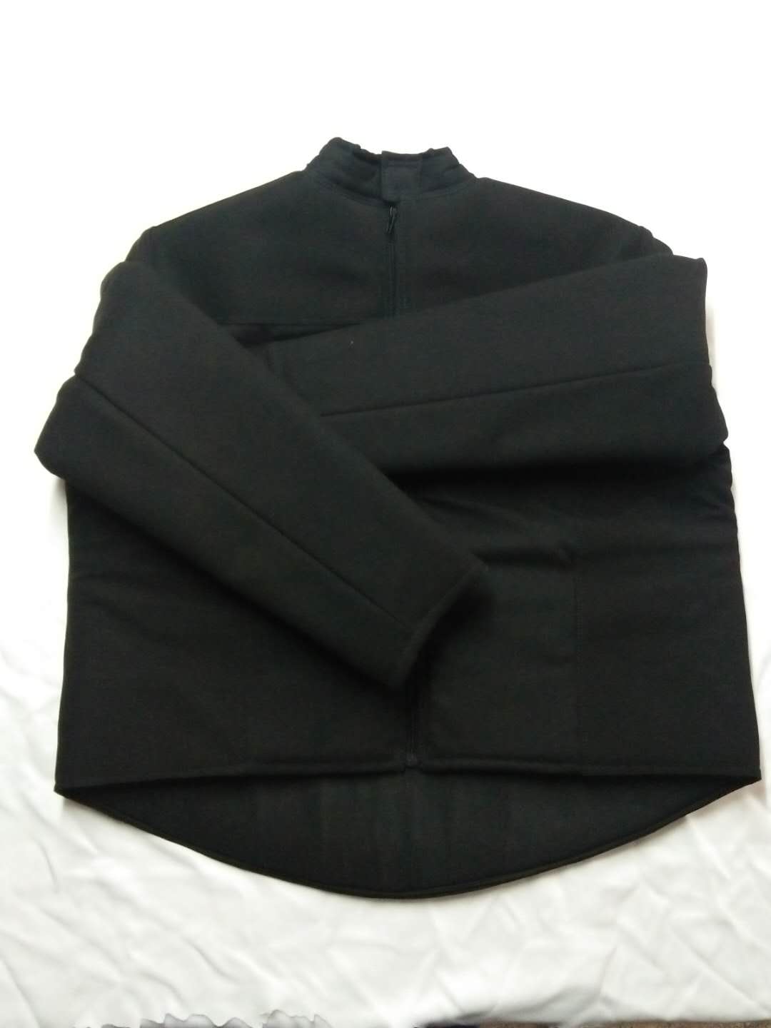 Fencing equipment, black canvas training suit rear open zipper design.