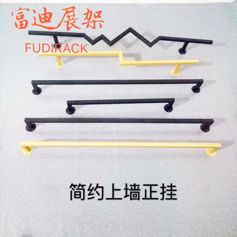 The clothing store displays the black gold wall hanging iron artist shelves on the wall of the boys and girls' clothing store