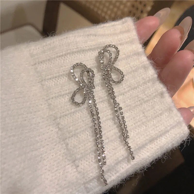 2021 new net red butterfly knot full drill flow Su senior feel earrings round face earrings South Korean personality 100 hitch