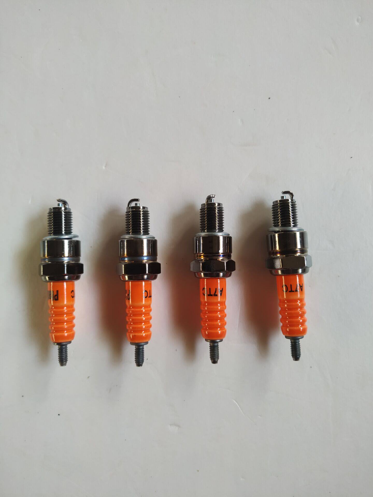 Fire mouth ghost fire pedal Jialing 70 motorcycle spark plug 125 150 A7TC platinum gold host matching