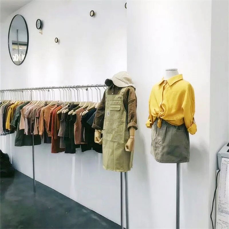 Clothing store display rack on the wall hanging simple gold side hanging display rack women's clothing store decoration design drawing