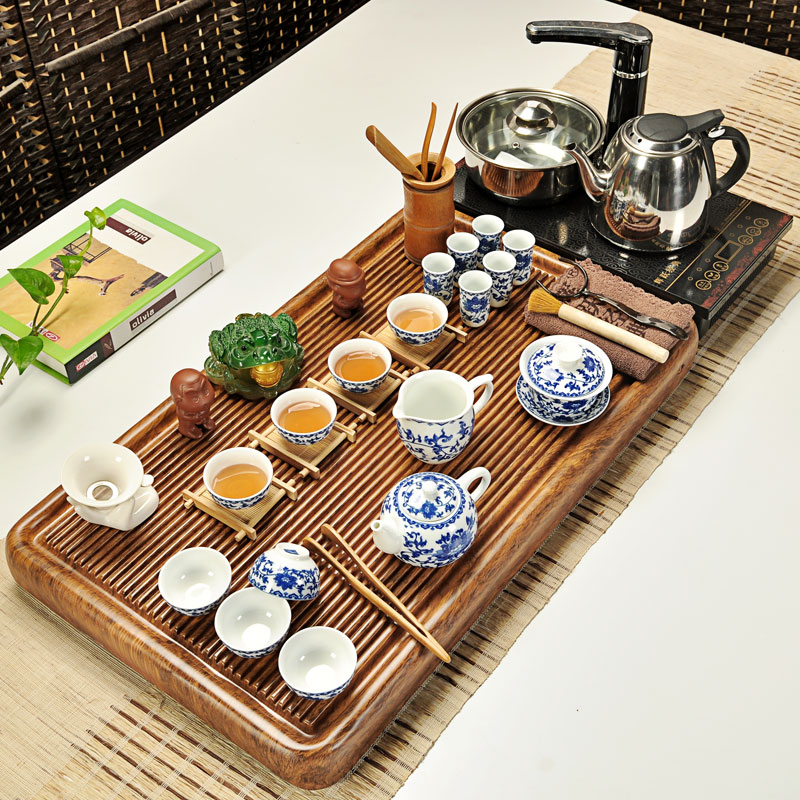 Fai jump ou a complete set of kung fu tea set household ceramics induction cooker electric wood tea tray of a complete set of tea cups