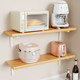 Microwave oven storage rack on solid wood wall