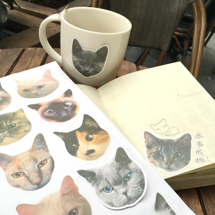 There are cats, punk cat head stickers, cat suitcase stickers, self-adhesive waterproof decorative stickers and paper, large