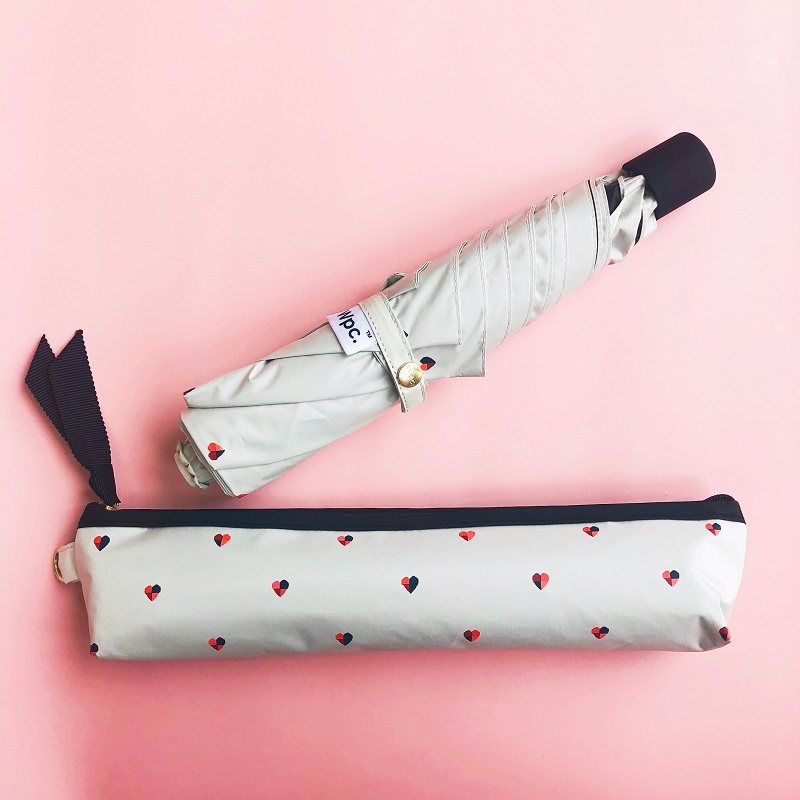 Japan imported WPC parasol two-color peach heart love beach black glue ultra-light color glue three-fold umbrella pen bag umbrella