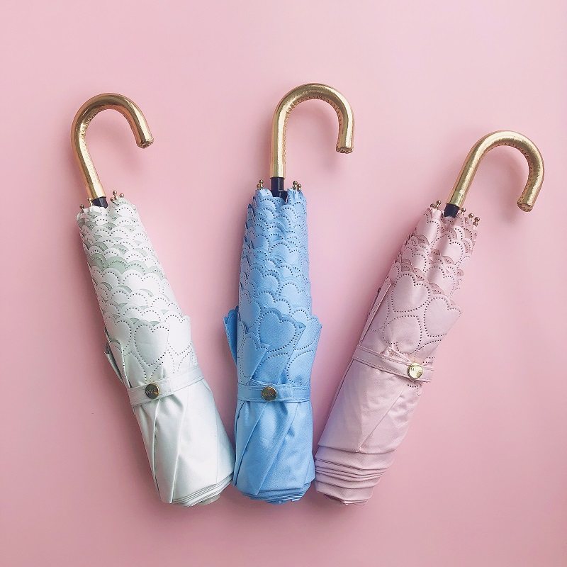 Japan imported WPC umbrellas sunny and rainy umbrellas cute solid color cute ultra-light hollow love small fresh petals