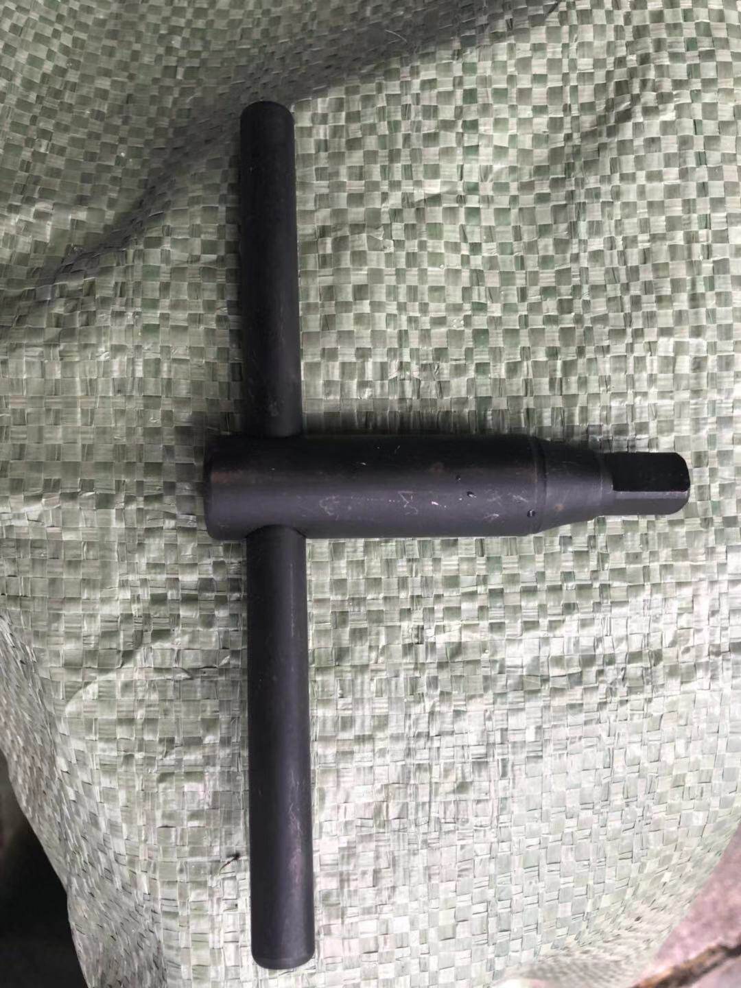 Three-claw collet key wrench with a hand grip