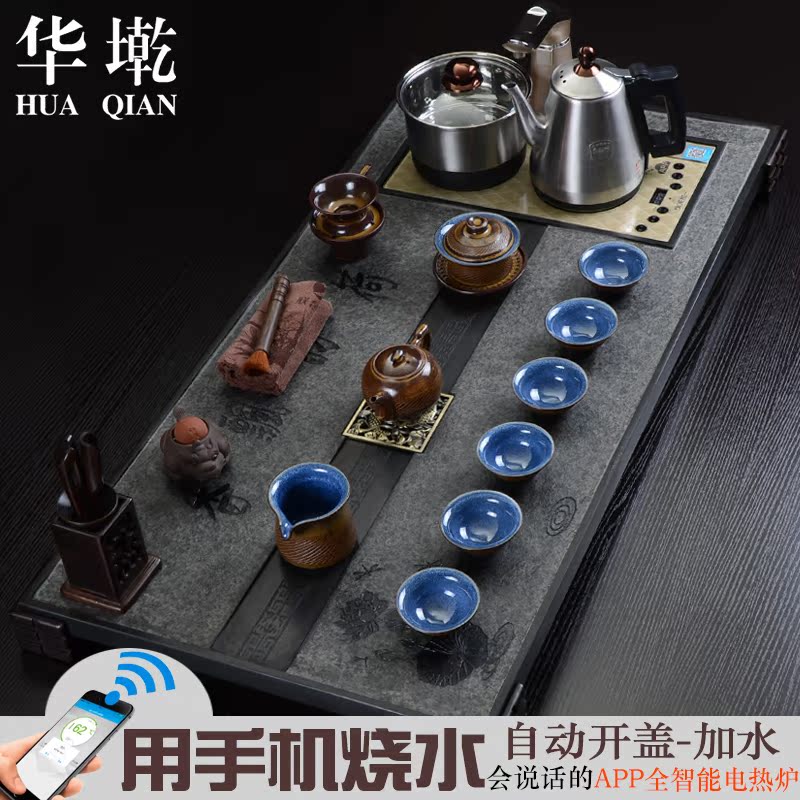 China Qian large sharply black stone tea tray and induction cooker four tea tea sea of a complete set of kung fu tea set