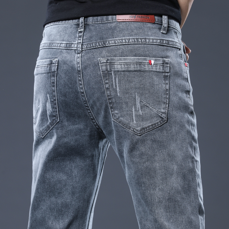 Spring and autumn new jeans Men's Han version Tide Card Youth Sashimi elastic long pants trendy casual narrow footed pants man