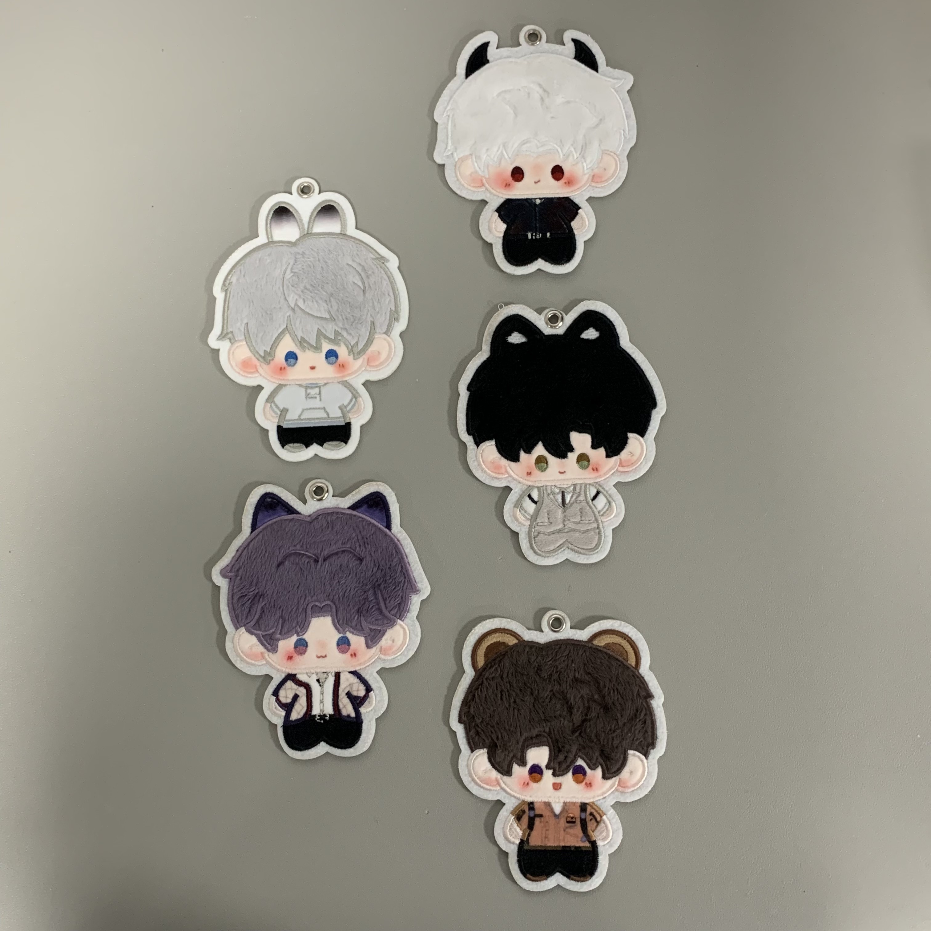 Five 3.94 inch Love and Deepspace character charms in a vertical arrangement