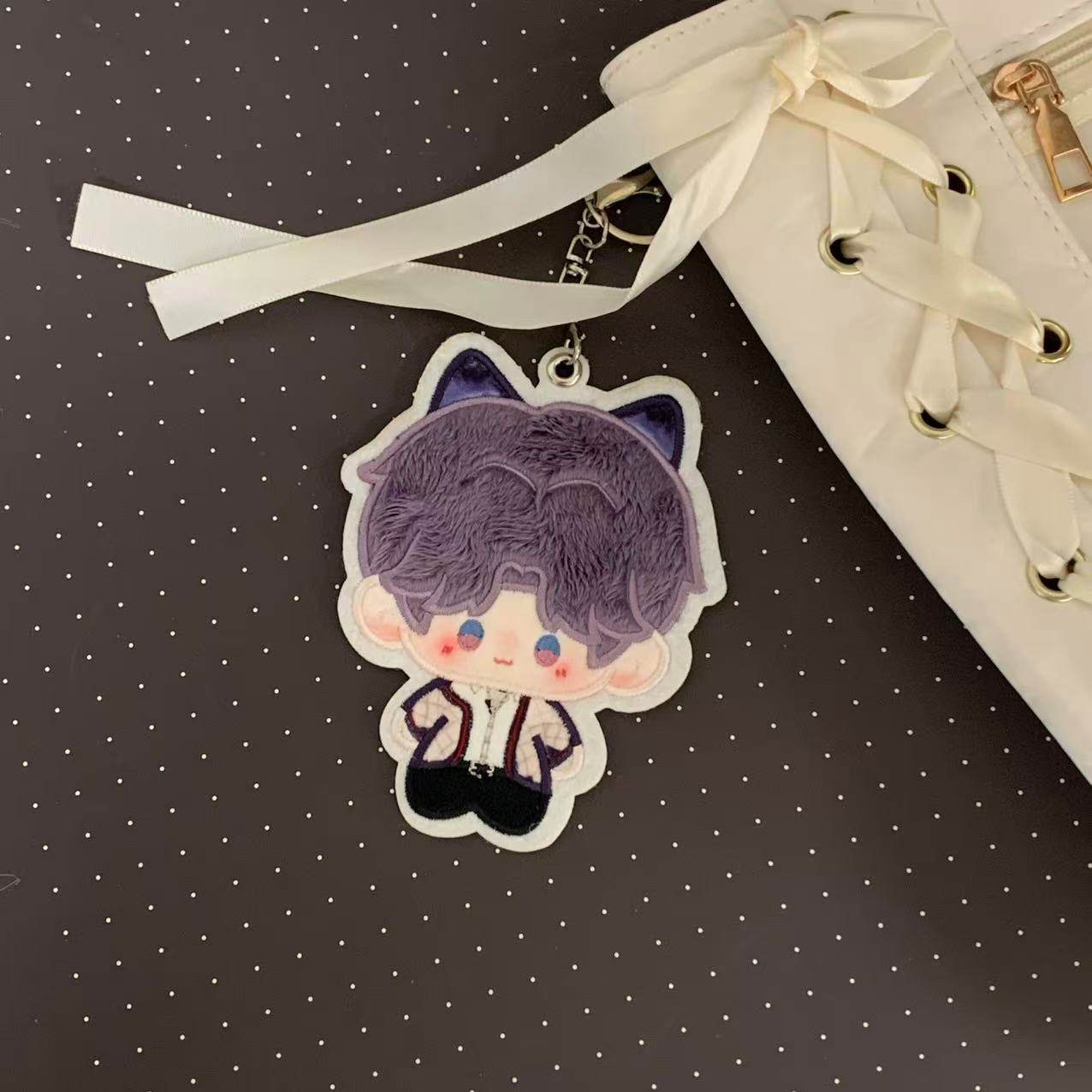 Fan-made Rafayel embroidered plush charm attached to a bag