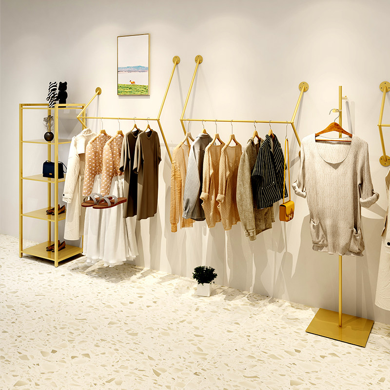 Gold clothing store display rack on the wall side hanging wall-mounted women's store clothing rack shelves Clothes rack hangers