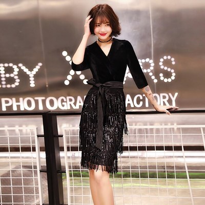 Black colored elite evening dress, skirt, bright catchy style, mid length