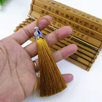 Кисточка землисто-желтого перегородчатого цвета