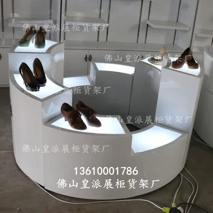 Showroom shop with lights half arc circular trapezoid sculpture high and low water island cabinet bag shoes sample shelf display stand