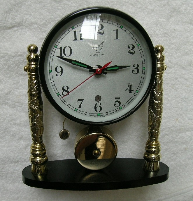 In the 1990s, the extinction inventory of new white pigeon old mechanical alarm clock antique horseshoe dragon column to the bell