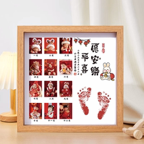 One-year-old baby bunnys hand and foot prints 12-month photo commemorating the babys 100th day one year old and one gift hand and foot prints photo frame