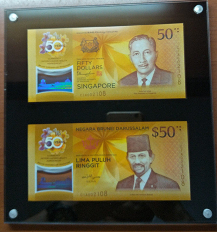 50th anniversary of the equivalent circulation of Singapore Brunei currency Two identical acrylic framed albums