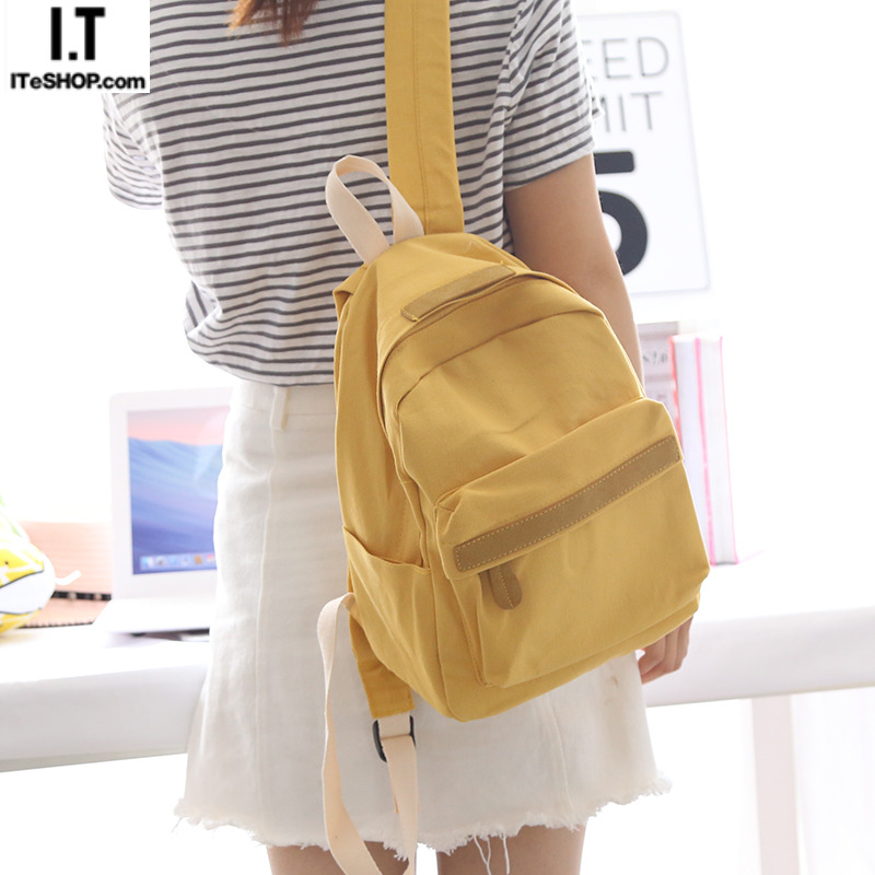 Hong Kong solid color small fresh canvas backpack women's new backpack female shoulders high school students schoolbag size