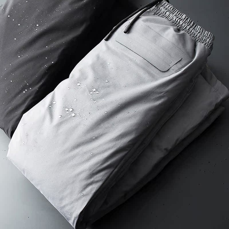 2020 Winter new white goose down waterproof down pants male press glue thicken warm outside wearing loose and large size for youth