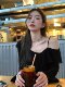 Ruffled trumpet sleeve black slanted shoulder long-sleeved T-shirt for women with spring and autumn temperament and irregular sweet and spicy off-shoulder top