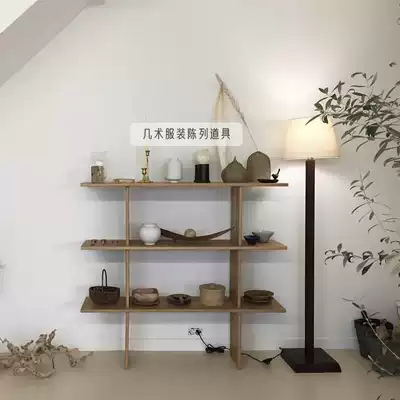 Clothing store window decoration platform in the island display running table in the middle of the table with bag display shelf