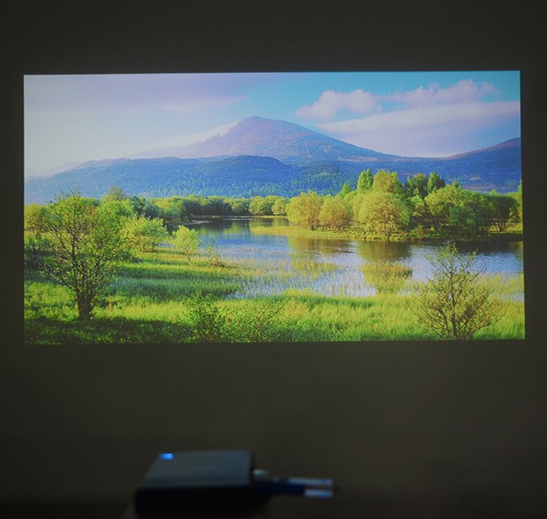 Le Jiada S1 máy chiếu điện thoại di động HD mini 3D máy chiếu di động 1080p điện thoại di động không dây mini rạp hát tại nhà phòng ngủ ký túc xá Apple Android không có TV màn hình - Máy chiếu