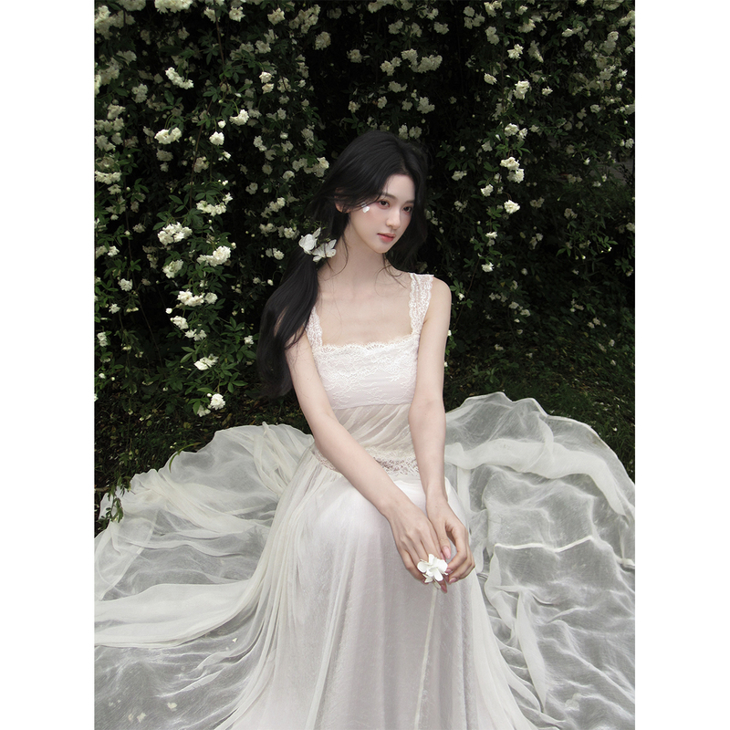 From the Moment You Wear It, the Gentle and Elegant Lace Camisole Dress with a Large Hem Is a Feminine Long Dress That Ties at the Waist to Create a Slimming Effect From the Moment You Wear It, the Gentle and Elegant Lace Camisole Dress with a Large Hem Is a Feminine Long Dress That Ties at the Waist to Create a Slimming Effect