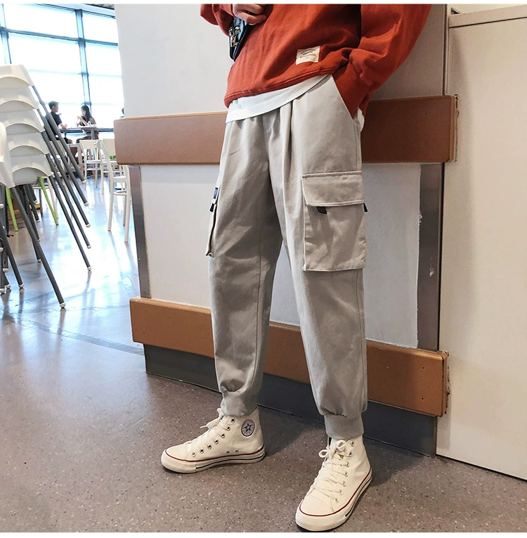 Hồng Kông phong cách mùa thu mới màu rắn nhiều túi dụng cụ lỏng lẻo quần nam thanh niên giản dị quần ống chân chín