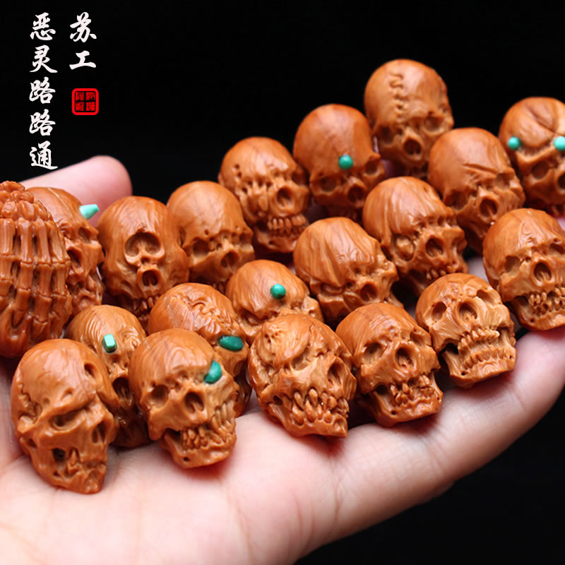 Suk olives nuclear carvings pure handmade carve skull head road pass by hand holding olive Hu evil spirits hanging long string of men and women
